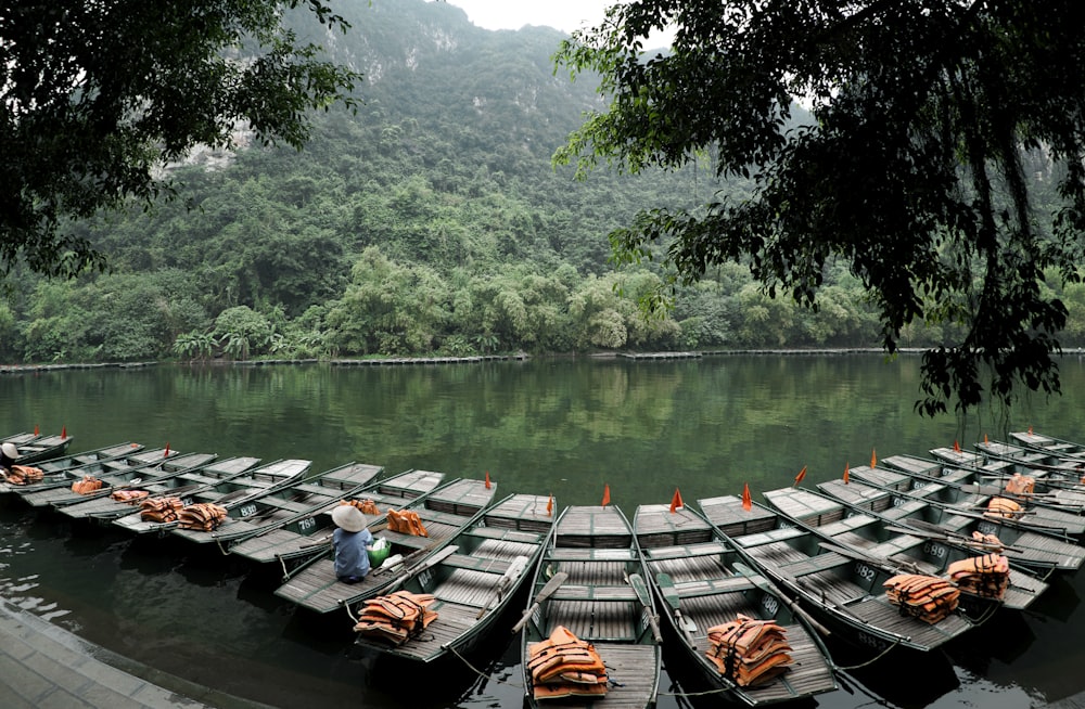 jon boats on river surrounded by trees