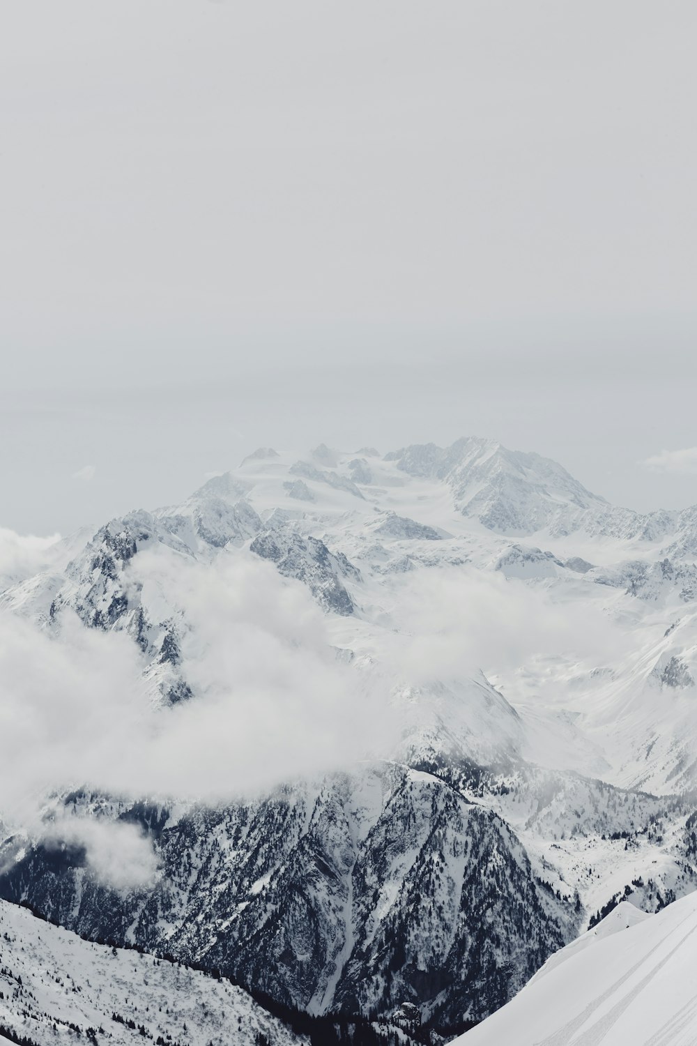 mountain alps under cumulus clouds