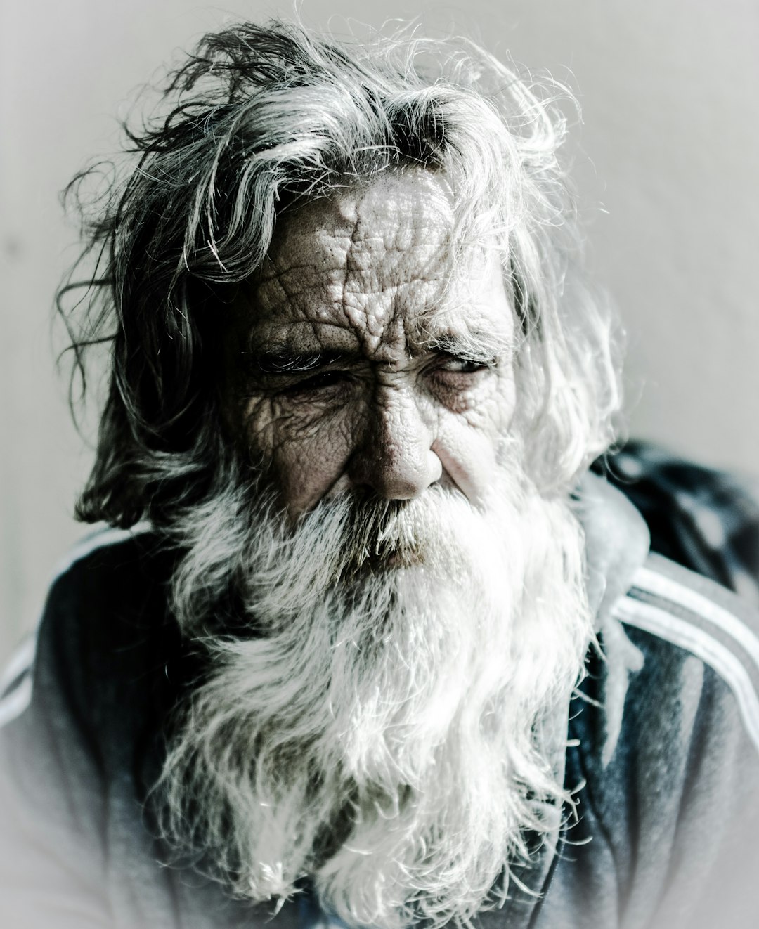 Met this amazing gentleman on State Street in Santa Barbara. He allowed me to shoot this image, capturing a face with lines that tell his story. Deep in thought, he sits in his wheelchair waiting, contemplating and staring into the world. A gentle man, who, although completely aware, does not speak.