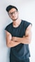 man wearing eyeglasses and sleeveless top