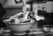 Family members preparing ramen together in the kitchen, showcasing the hands-on, authentic approach.