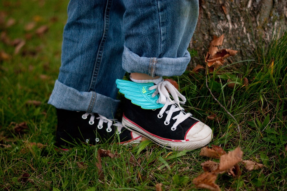 person standing on green grass field