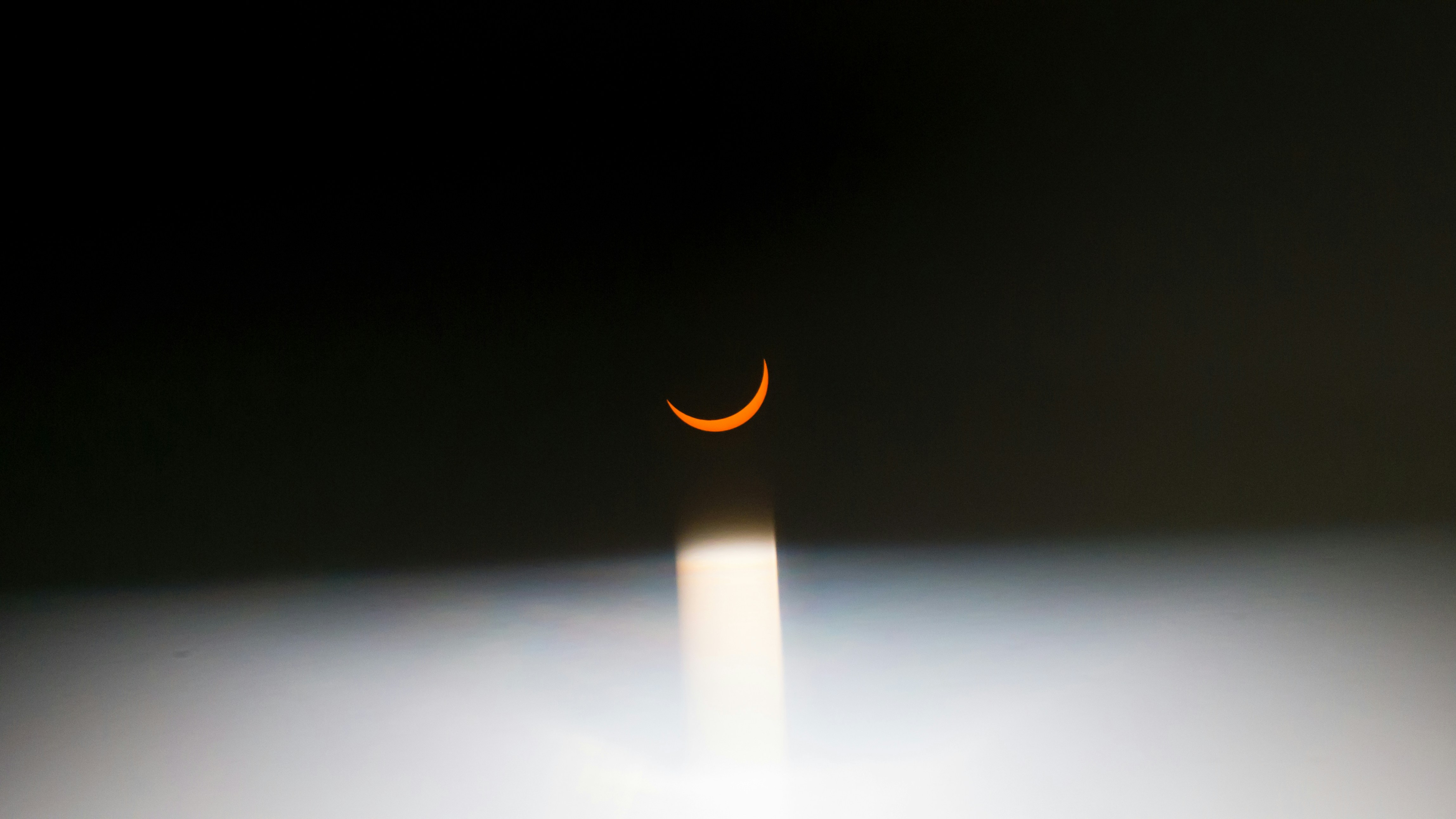 a red crescent moon surrounded by darkness. 2017 teams background