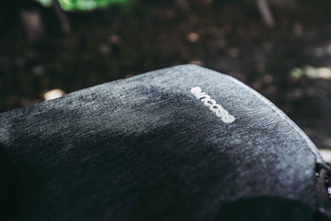 Close-up of the waterproof fabric texture on the backpack under morning light.