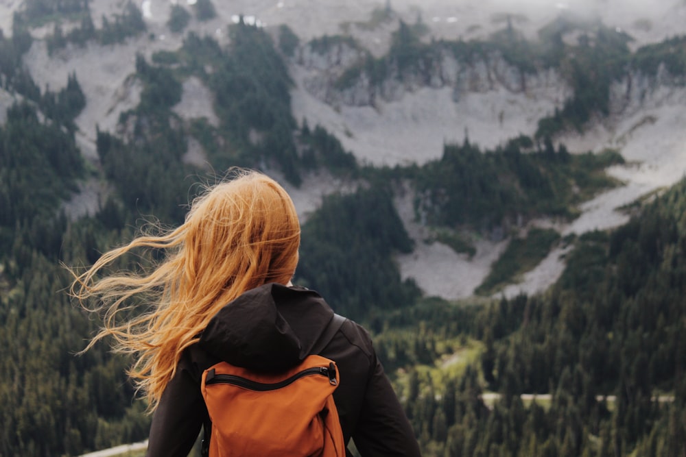 woman seeing mountain during daytime