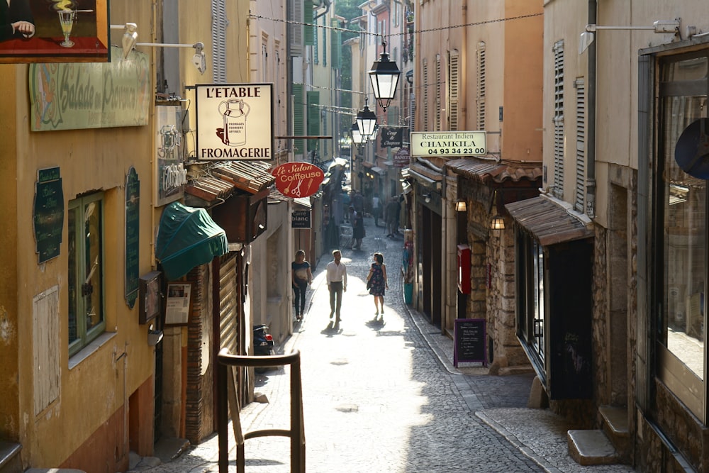 people walking between buildings