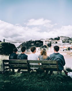 four man with one woman on bech