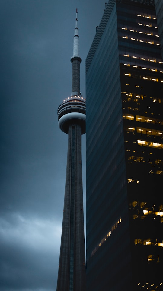 space needle beside building in CN Tower Canada