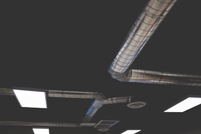 gray stainless steel pipes space station teams background