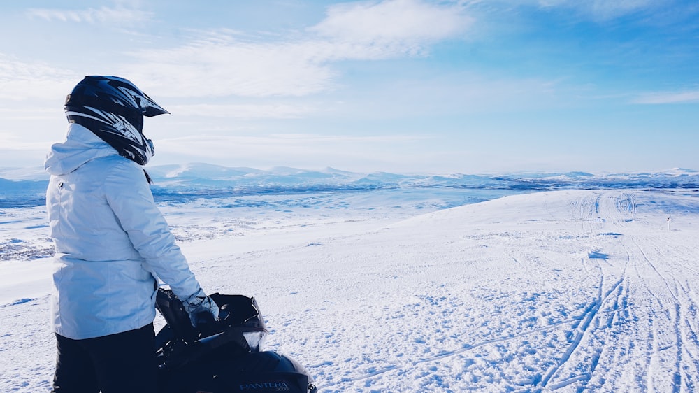 man riding snow mobile