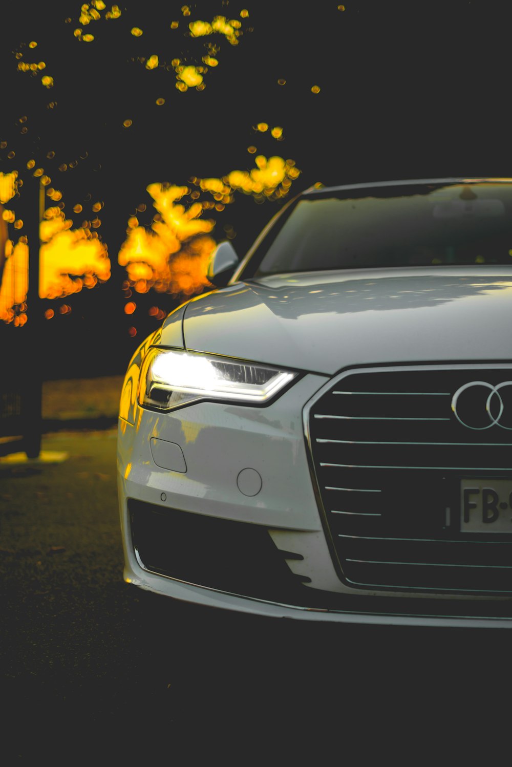 close shot of white Audi car