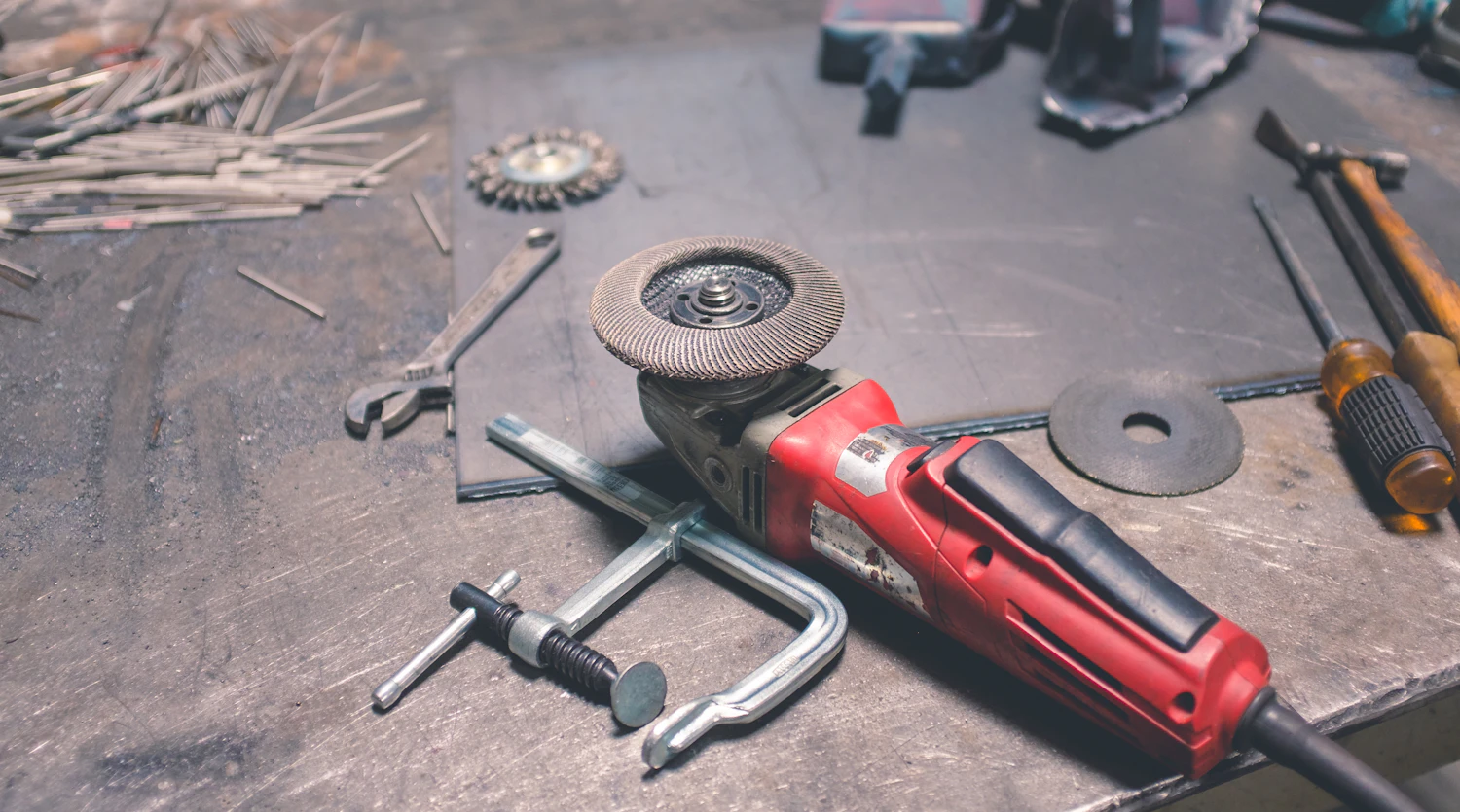 Assorted hand tools arranged on a workbench