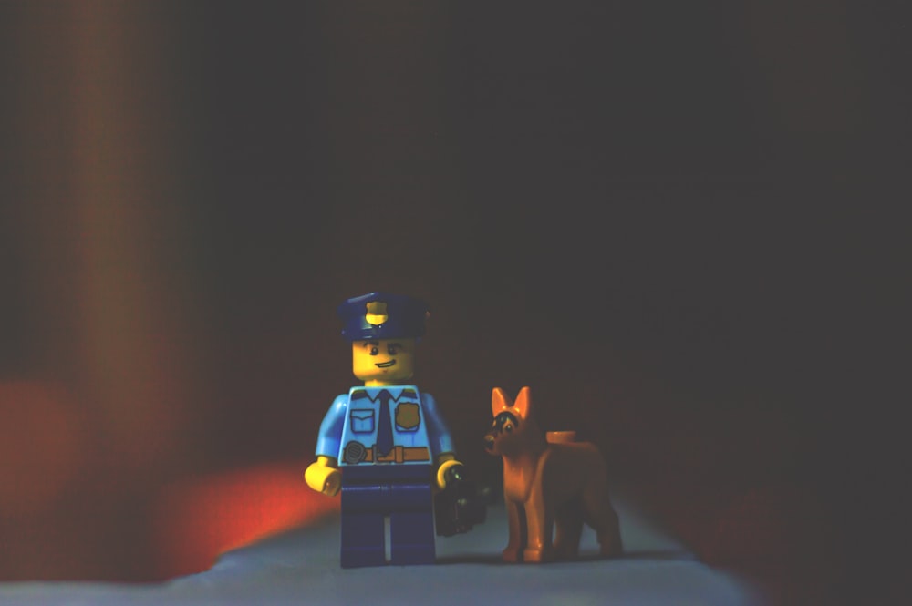 A Lego police officer guy and his police dog.