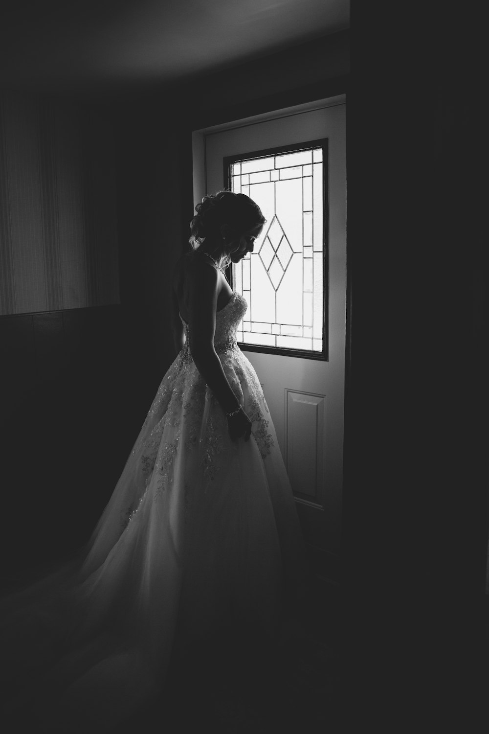 woman standing behind the door