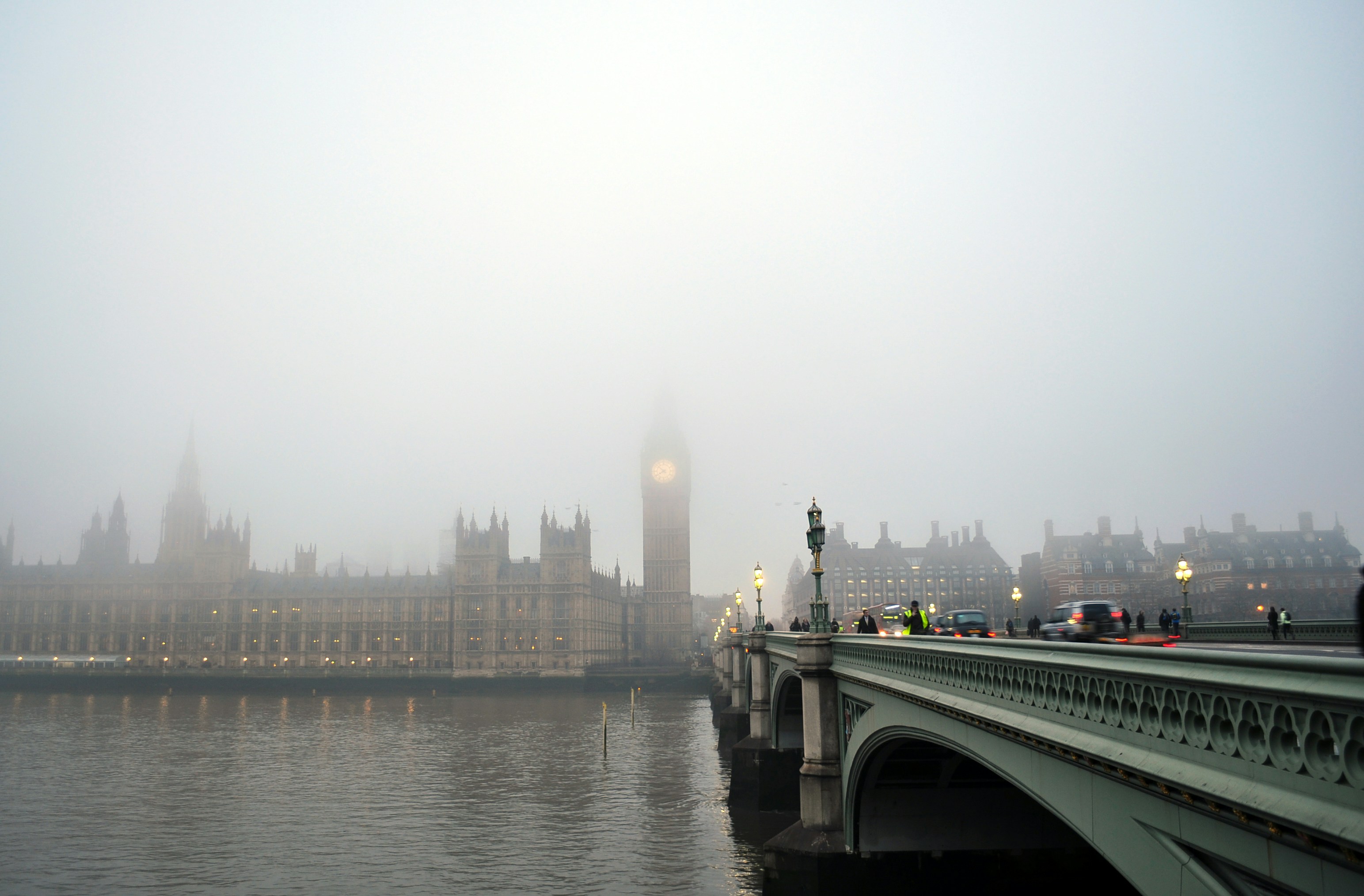 gray bridge towards Big Ben under gray sky