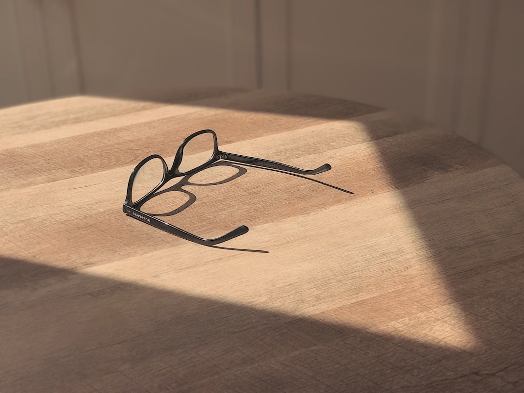 black-framed eyeglasses on table