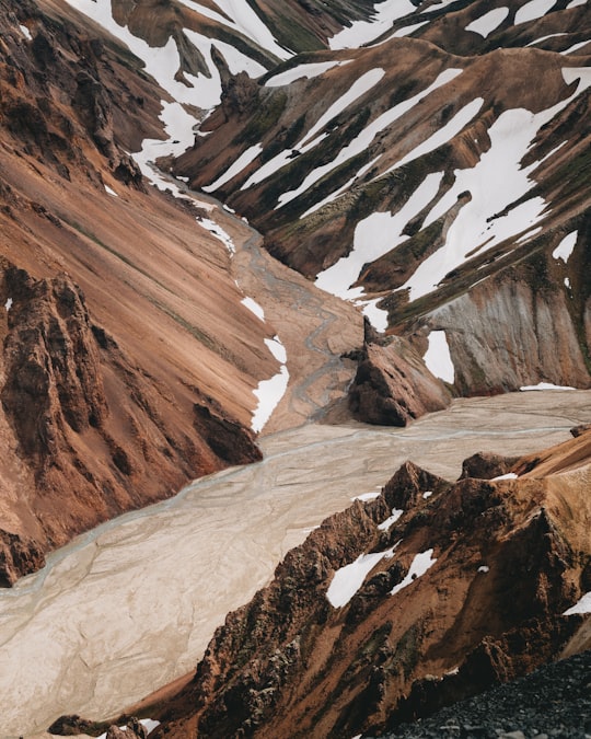 brown mountain covered by melting snow in Landmannalaugar Iceland