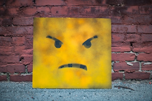 yellow and black smiley wall art