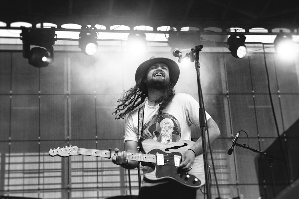 man playing electric guitar