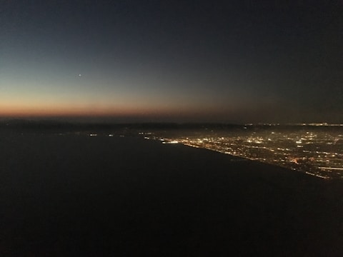 Visual representation of AI network connections over a city skyline at dusk