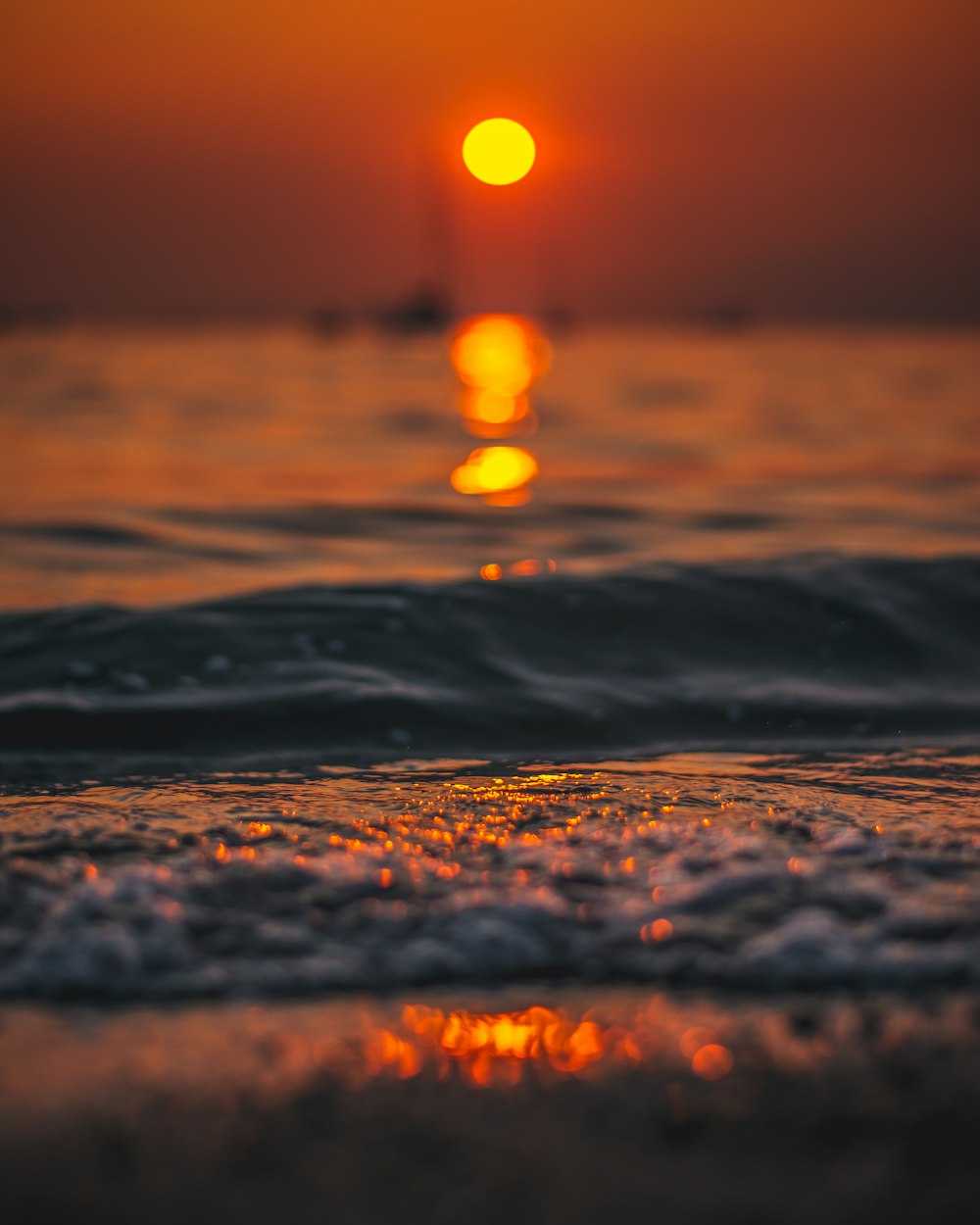 close up photo of beach water at golden hour