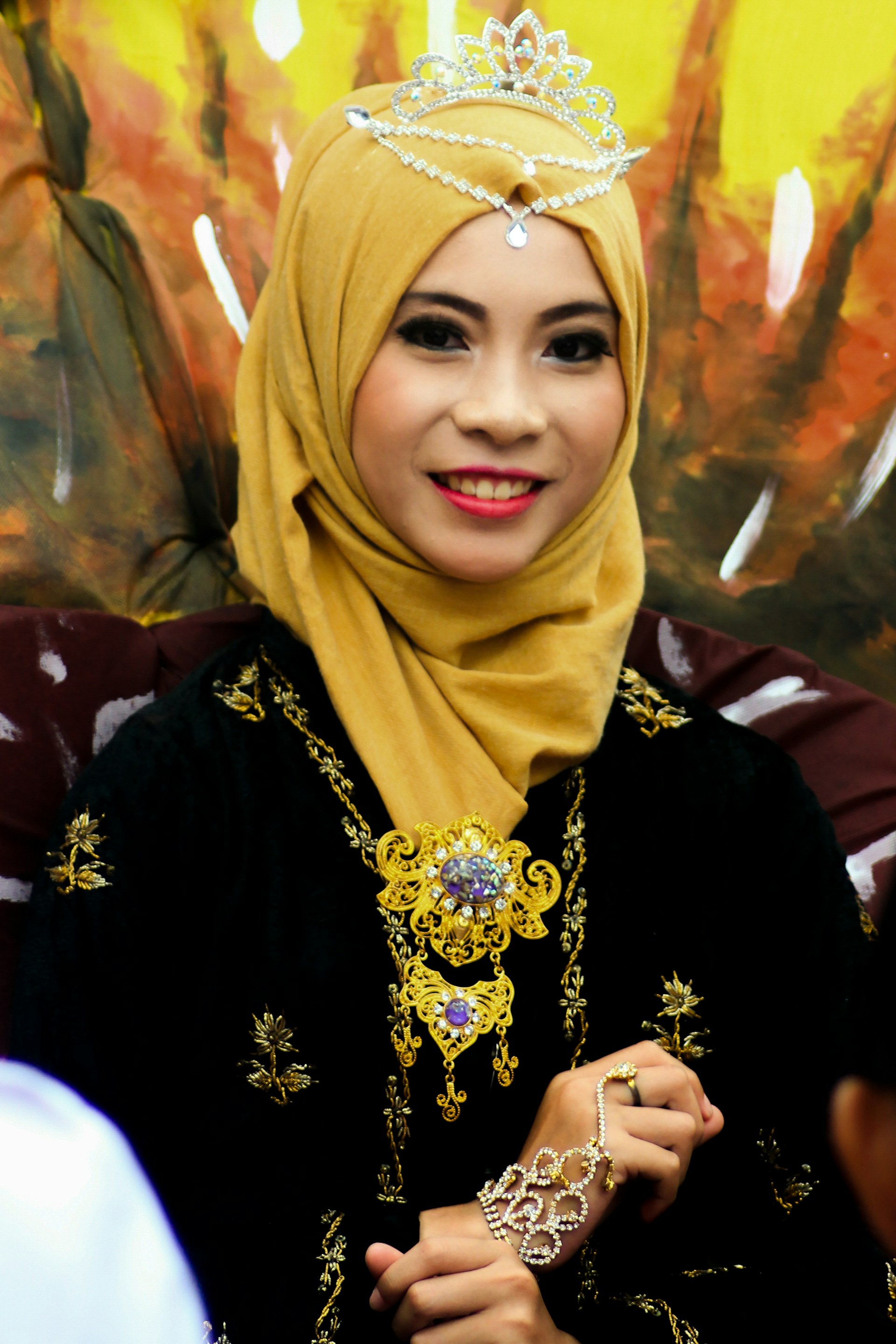 woman wearing yellow long-sleeved dress under white clouds and blue sky during daytime