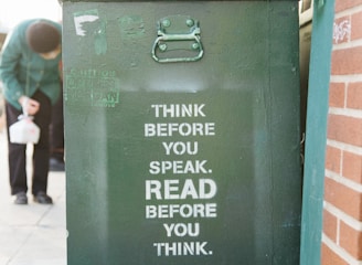 books over green trolley bin