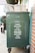 books over green trolley bin