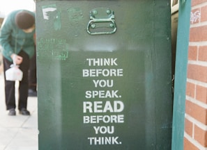 books over green trolley bin