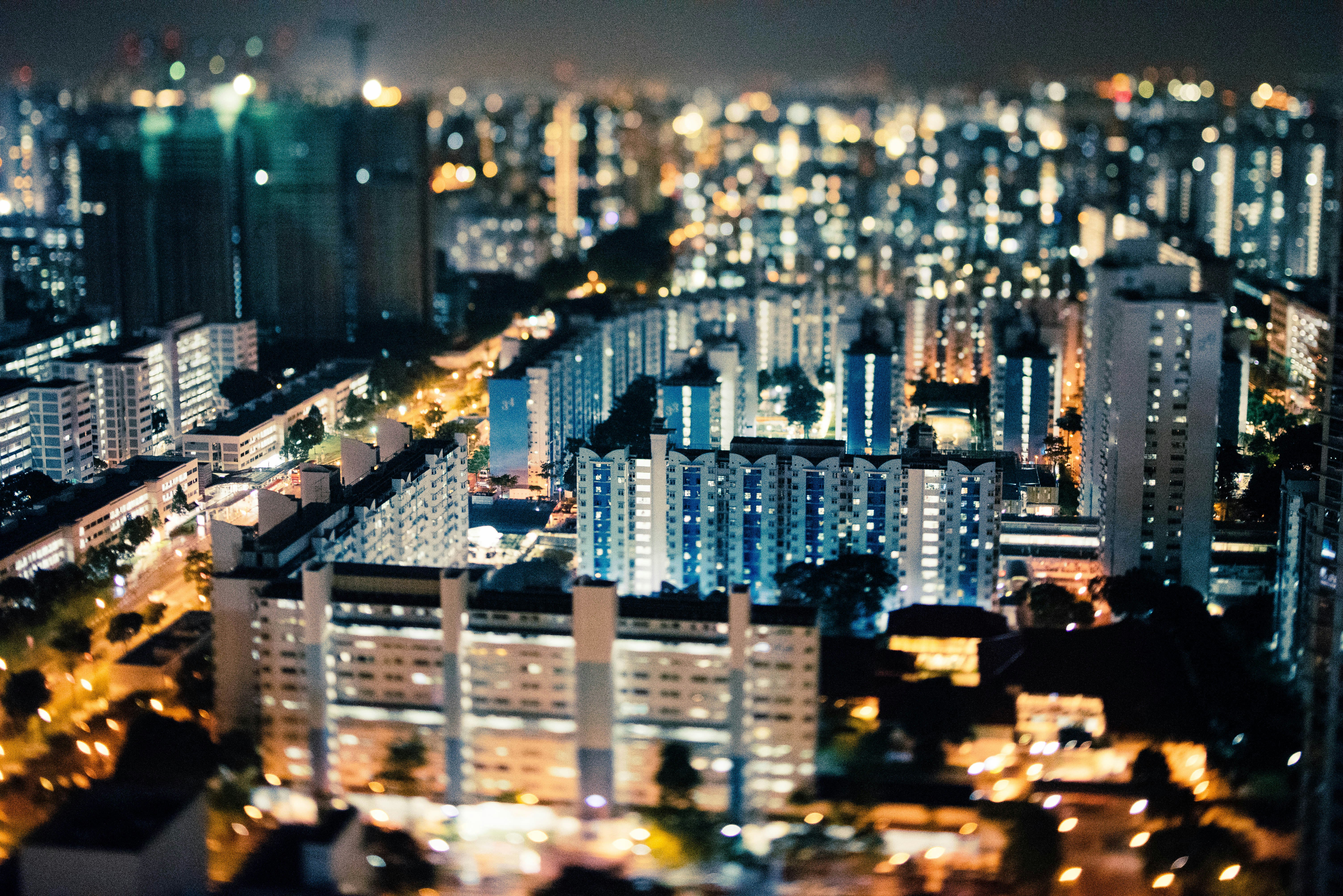 aerial photo of city buildings during night time