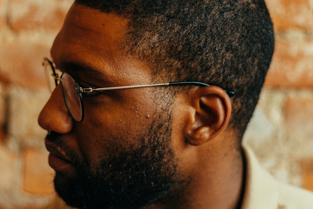 man wearing silver eyeglasses