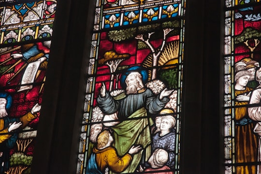low-angle photography of church stained glass window in Worcester United Kingdom