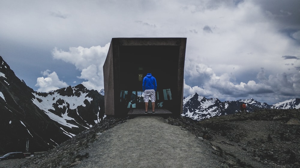 man standing on mountain