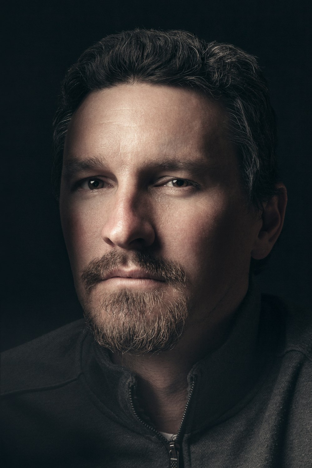 man in black top portrait photo