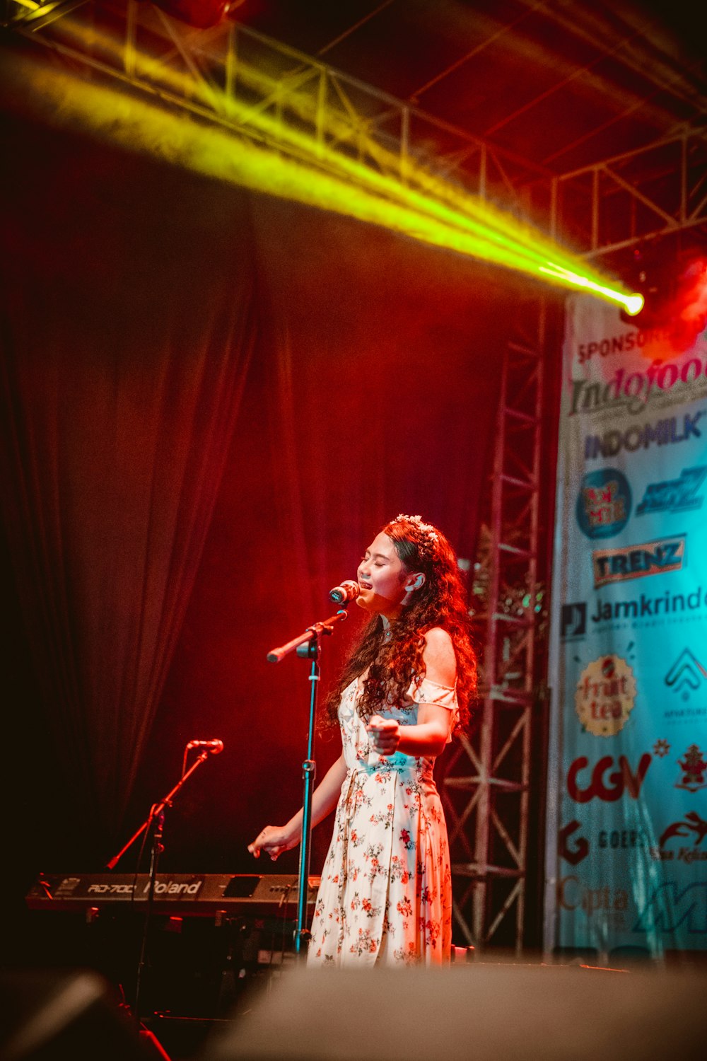 woman singing standing on stage