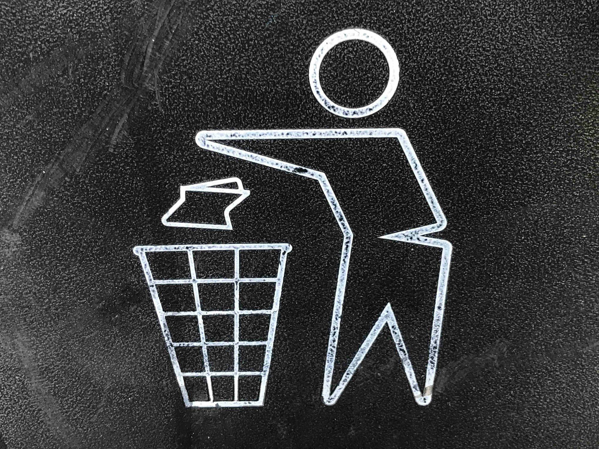 Close up of a recycle garbage bin logo at Pershing Square in Los Angeles, California.