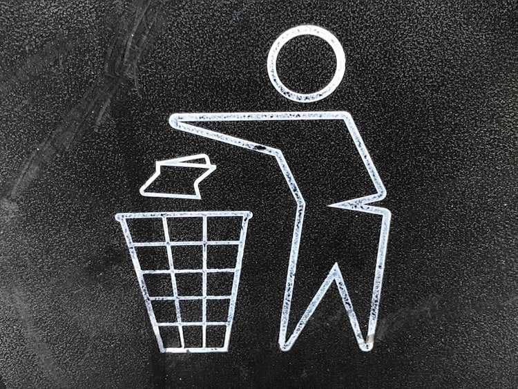 A man throwing out a piece of paper