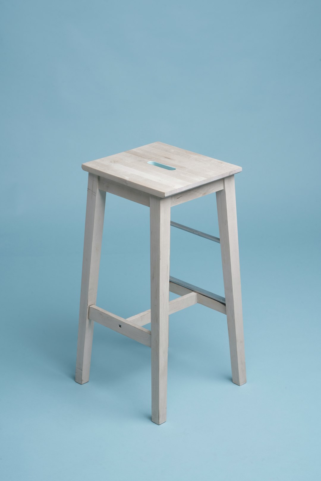 beige wooden bar stool
