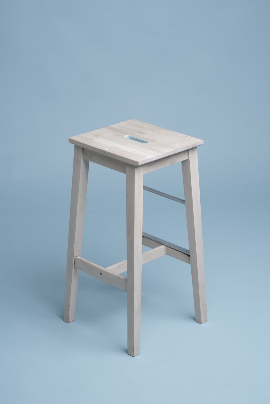 Wooden chair standing alone in a bright room