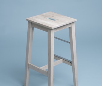 beige wooden bar stool