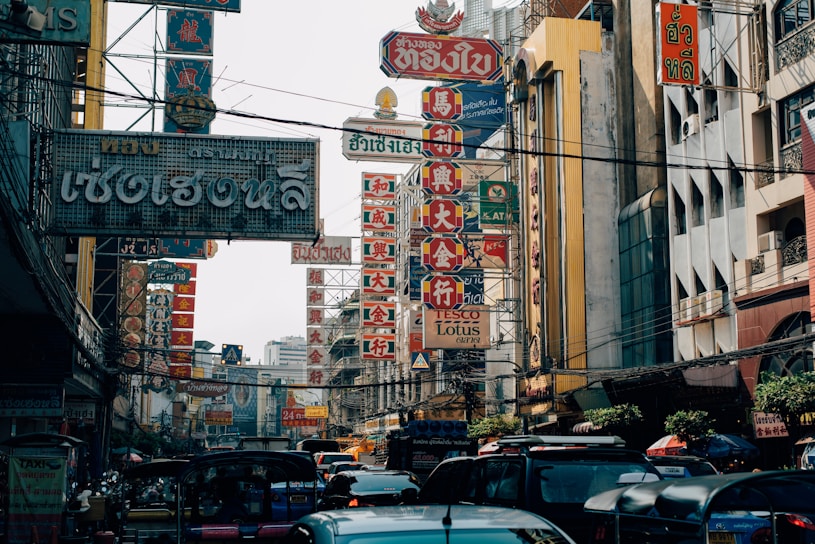 A vibrant street scene showcasing the chaotic traffic of Thailand.