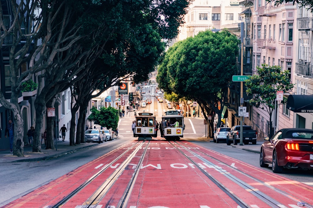 two rail cars on road