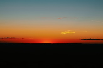 A serene sunset gradient blending warm browns, beiges, and golden yellows.