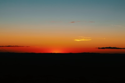 A serene sunset gradient blending warm browns, beiges, and golden yellows.