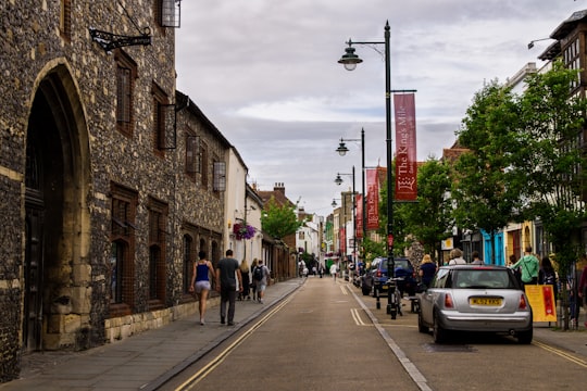 people walking on sidewalk near buildings during daytime in Canterbury United Kingdom