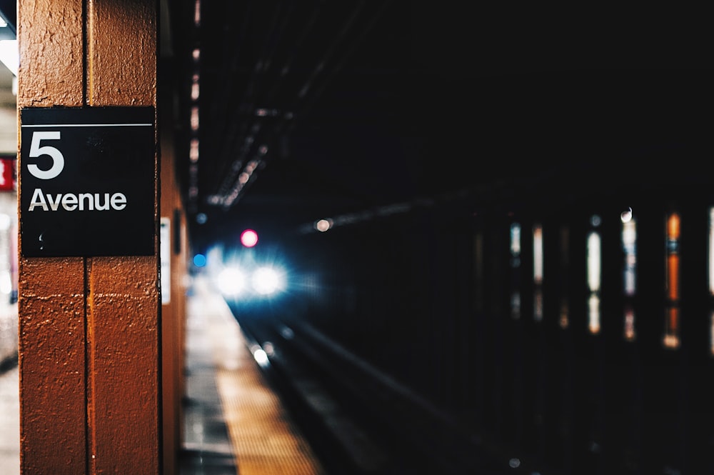 closeup photography of 5 Avenue train tunnel