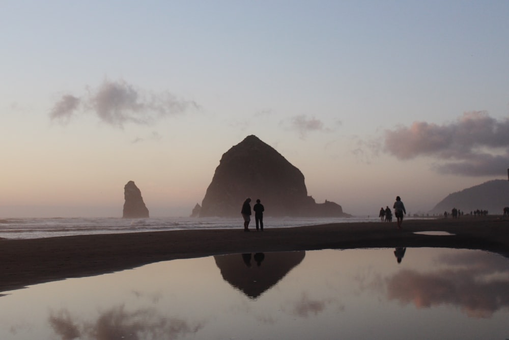 group of people near body of water