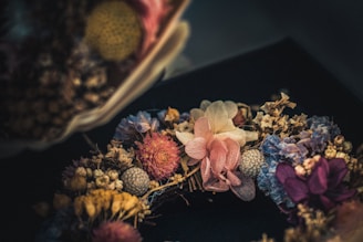 An artistic arrangement of handmade artificial flowers as a centerpiece.