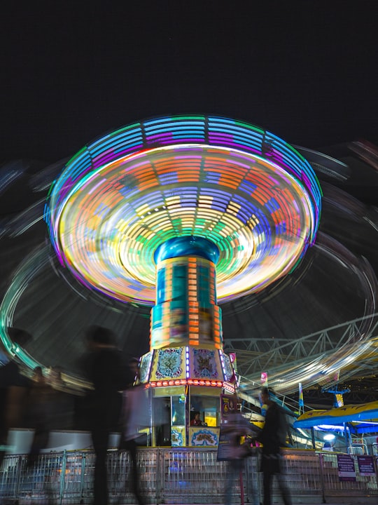 time-lapse photography amusement park ride at night in Canadian National Exhibition Canada