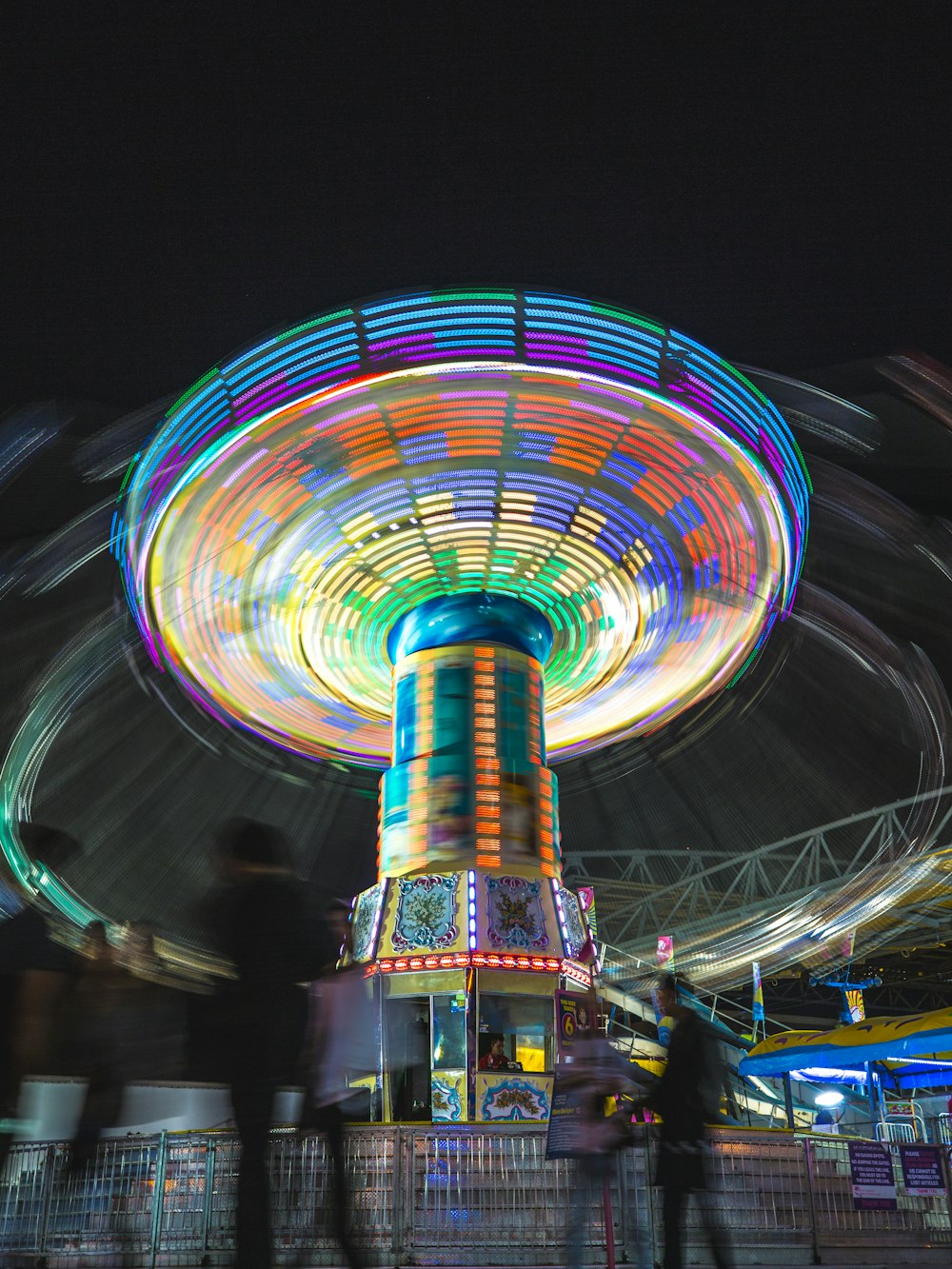 time-lapse photography amusement park ride at night